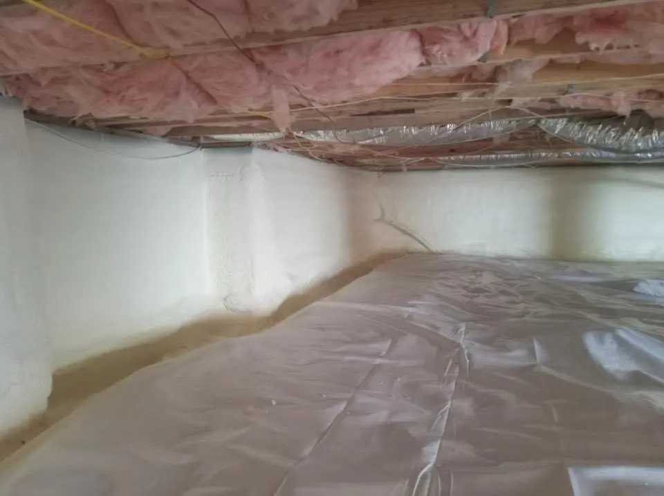 Crawl space encapsulation with closed-cell spray foam for Commercial Roof Restoration in Chelsea